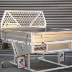 Heavy-duty flat tray featuring reinforced headboard tube