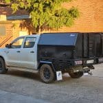 Toyota Hilux equipped with an L&G Chivalry aluminum canopy and toolbox.