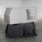 Dual-purpose canopy combining a ventilated dog box with a regular enclosed canopy space