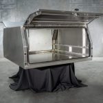 UTE canopy with lift-up door open, showing a spacious interior and reinforced frame construction