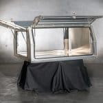 UTE canopy with lift-up doors open to reveal the internal storage area and reinforced framing