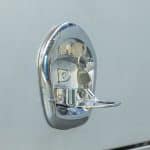 Detailed view of a chrome whale tail lock, part of a 3-point locking system for secure UTE canopy doors