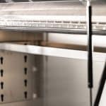 Dual gas struts assisting the lift-up door of a UTE canopy