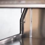 Interior corner of aluminium UTE canopy showing door frame and gas strut