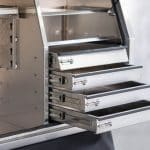 Toolbox interior showing adjustable shelf and four sliding drawers