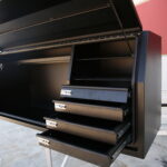 Black canopy interior featuring multiple storage shelves