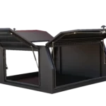 A black aluminium UTE canopy with its side and rear doors open upwards, showing the spacious interior design