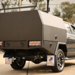 Matte black aluminium service body with two side-opening doors