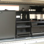 Interior storage setup of UTE canopy featuring moldular drawer system, fridge and organised shelving from Oz Chivalry