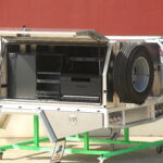 Work-tough UTE canopy including a full drawer and cutting board combo