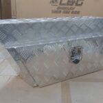 Alloy underbody toolbox with angled design and secure latch