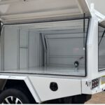 White aluminium service body with three side-opening doors